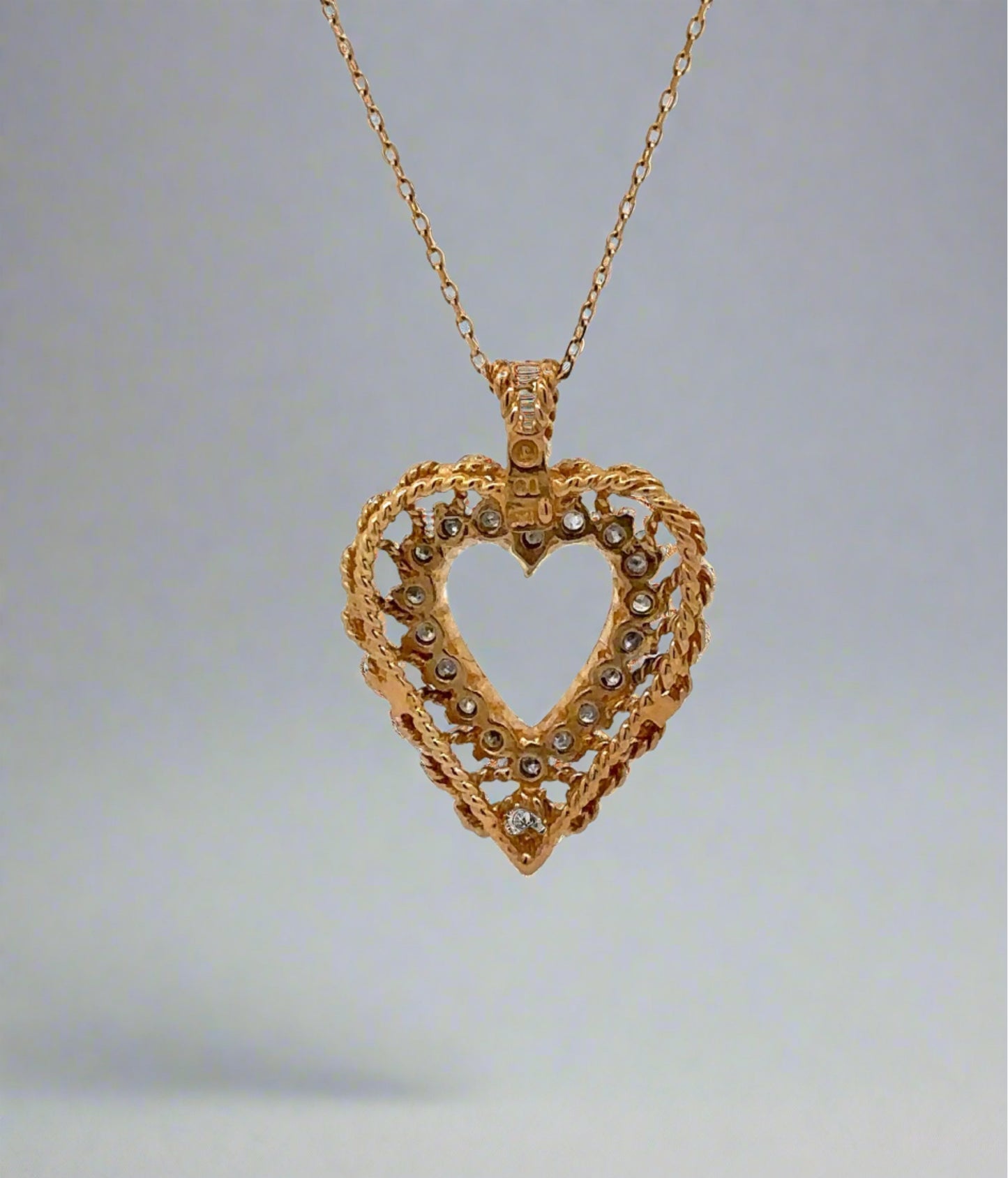 back of necklace with gold detailing around heart