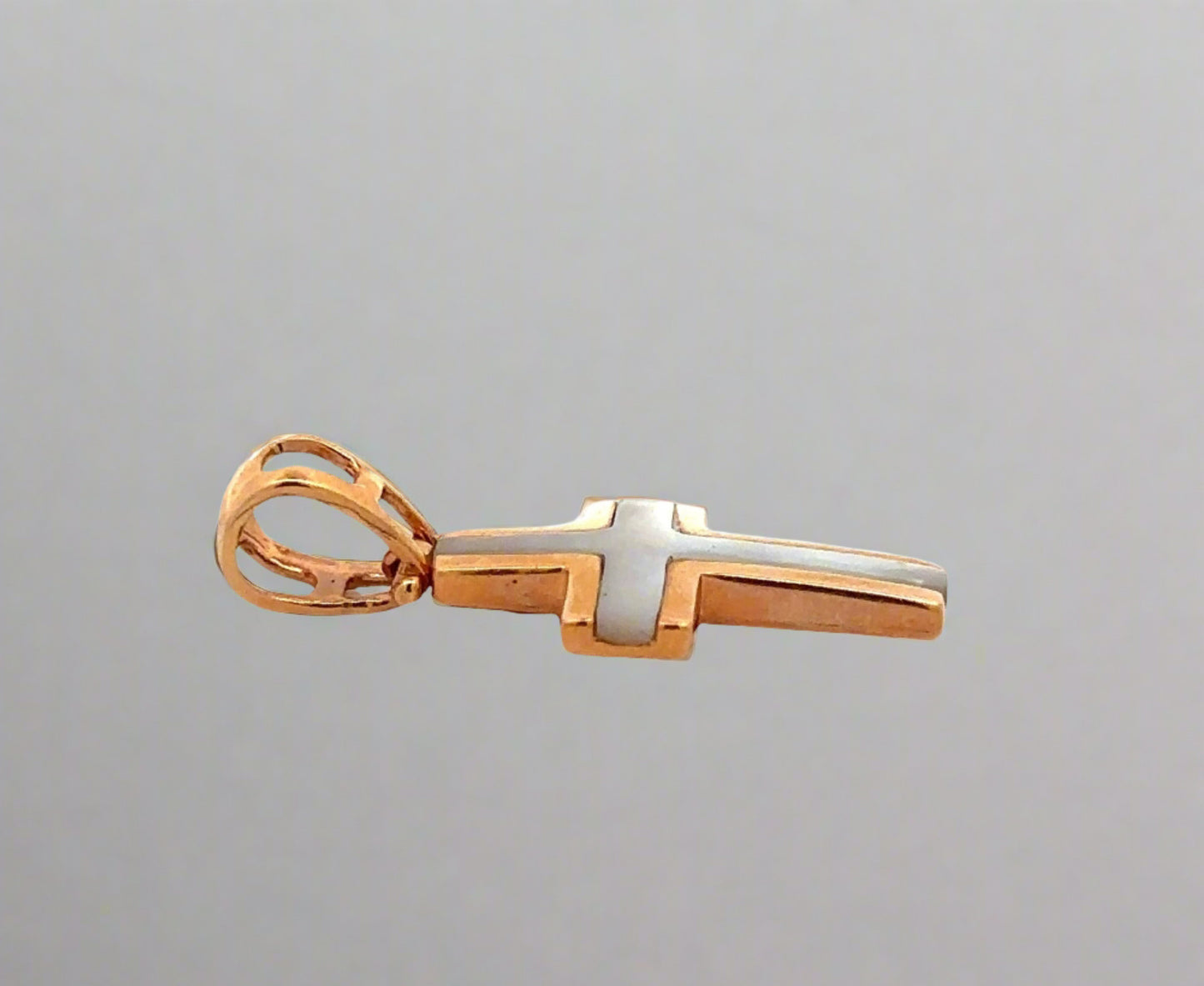 Side of rose gold pendant with round bail