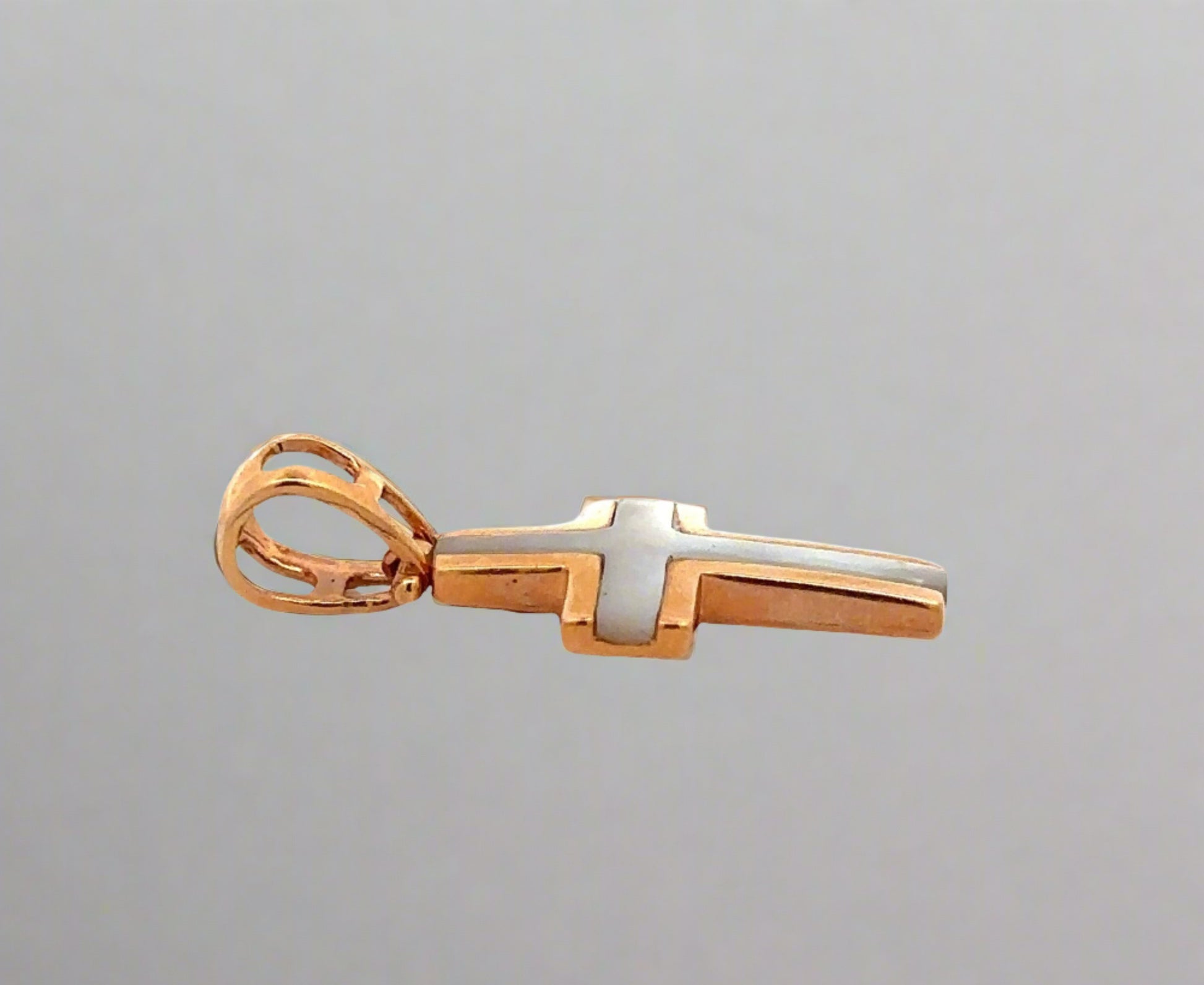 Side of rose gold pendant with round bail