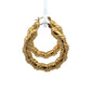side view of yellow gold hoops with wrapped detailing