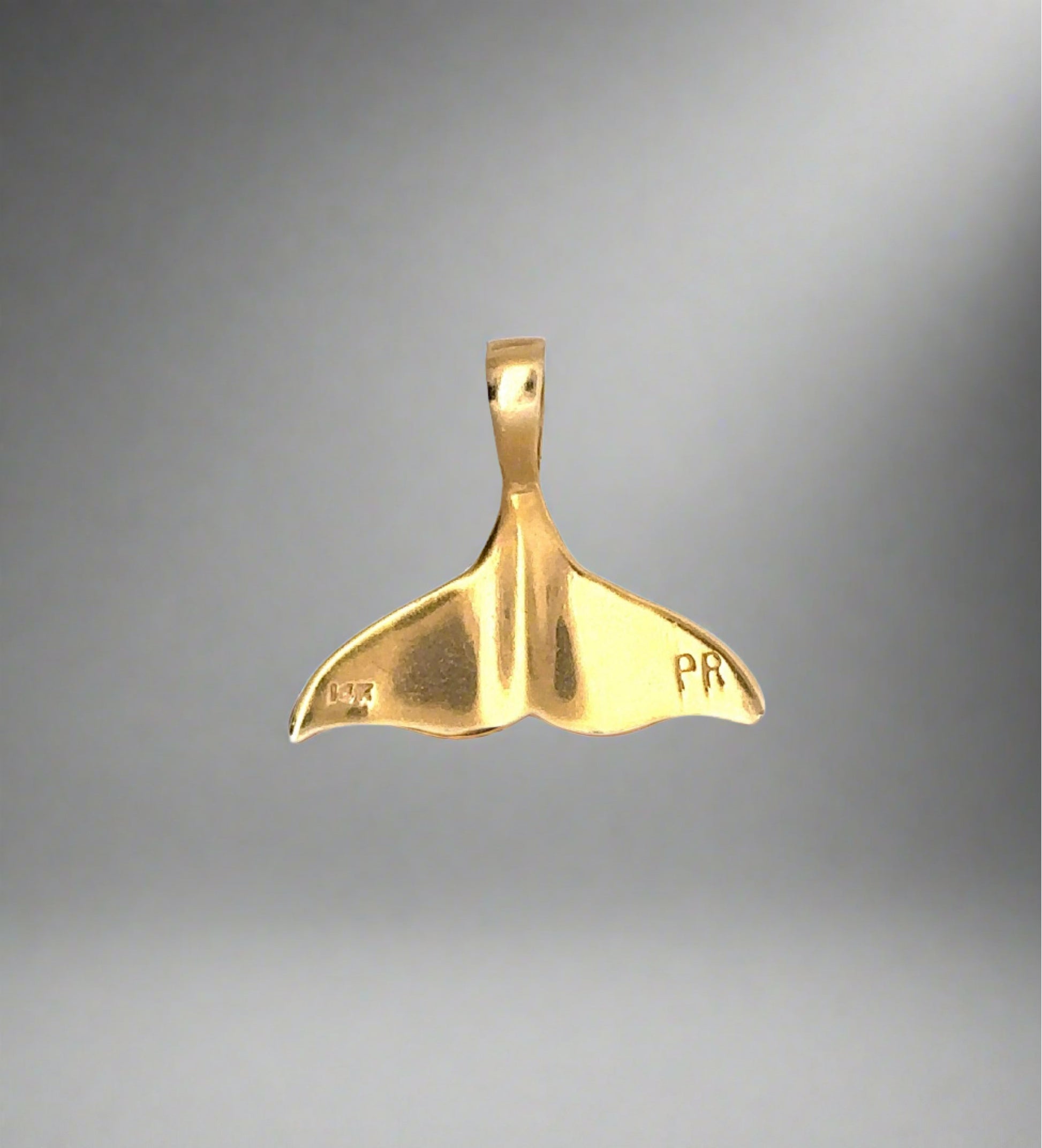 back of yellow gold whale tail pendant with "PR" + 14K stamp