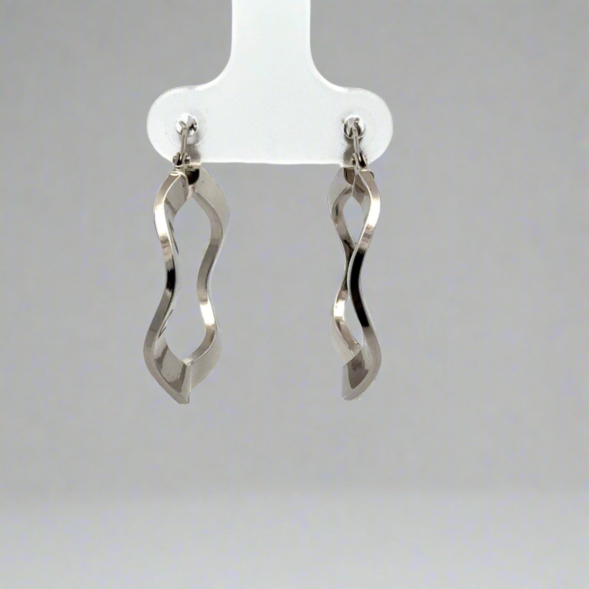 back of white gold wavy hoops