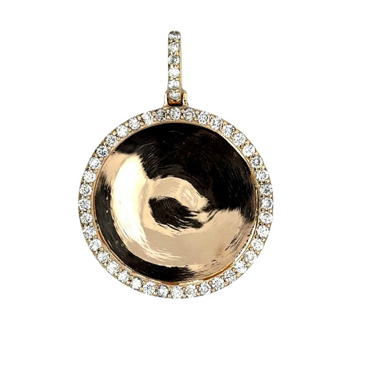 Front of round yellow gold diamond photo pendant with round diamonds around the pendant and on the bail