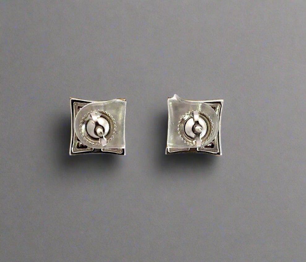 Back of white gold square earrings showing screwbacks