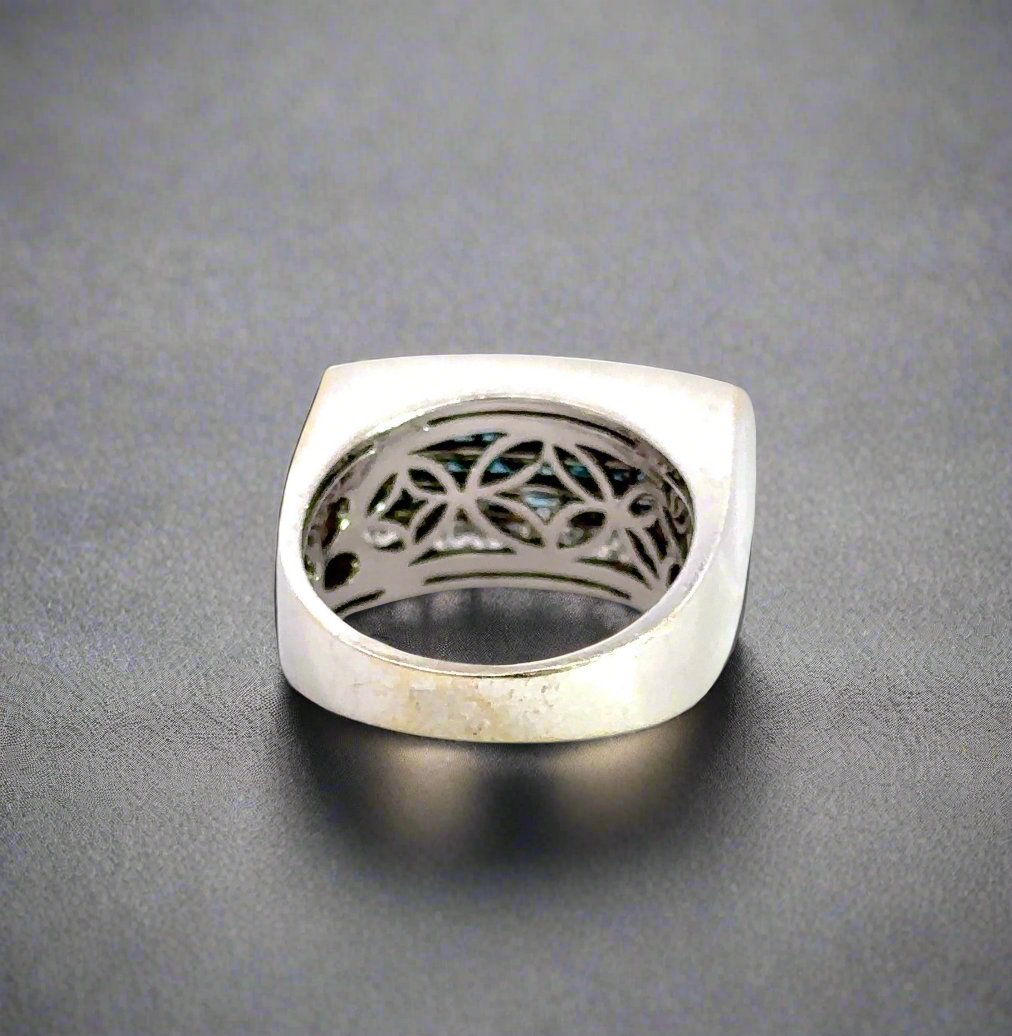back of white gold ring with signs of wear on gold