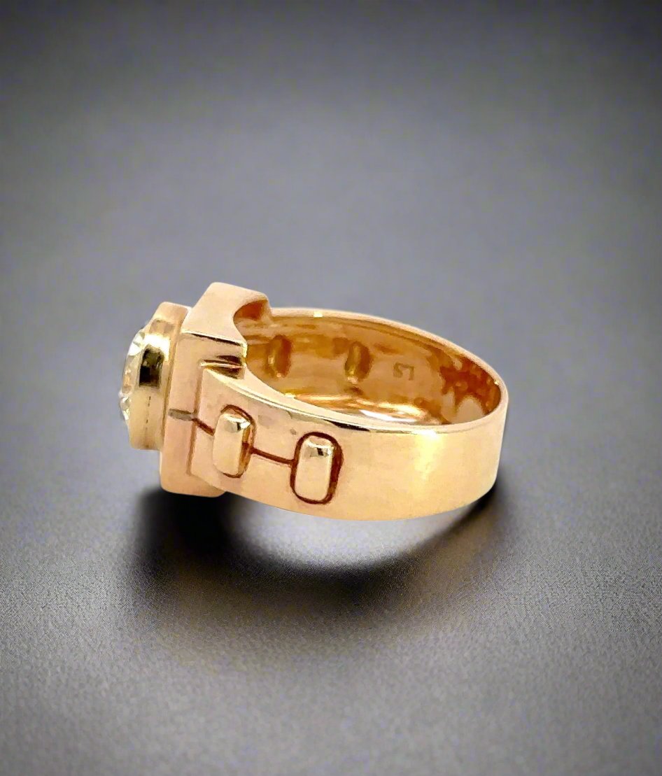 side of yellow gold ring with light scratches on gold