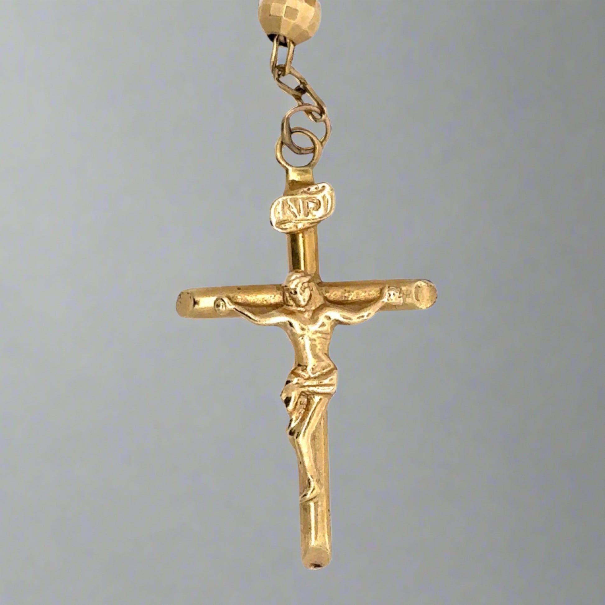 close up of cross pendant