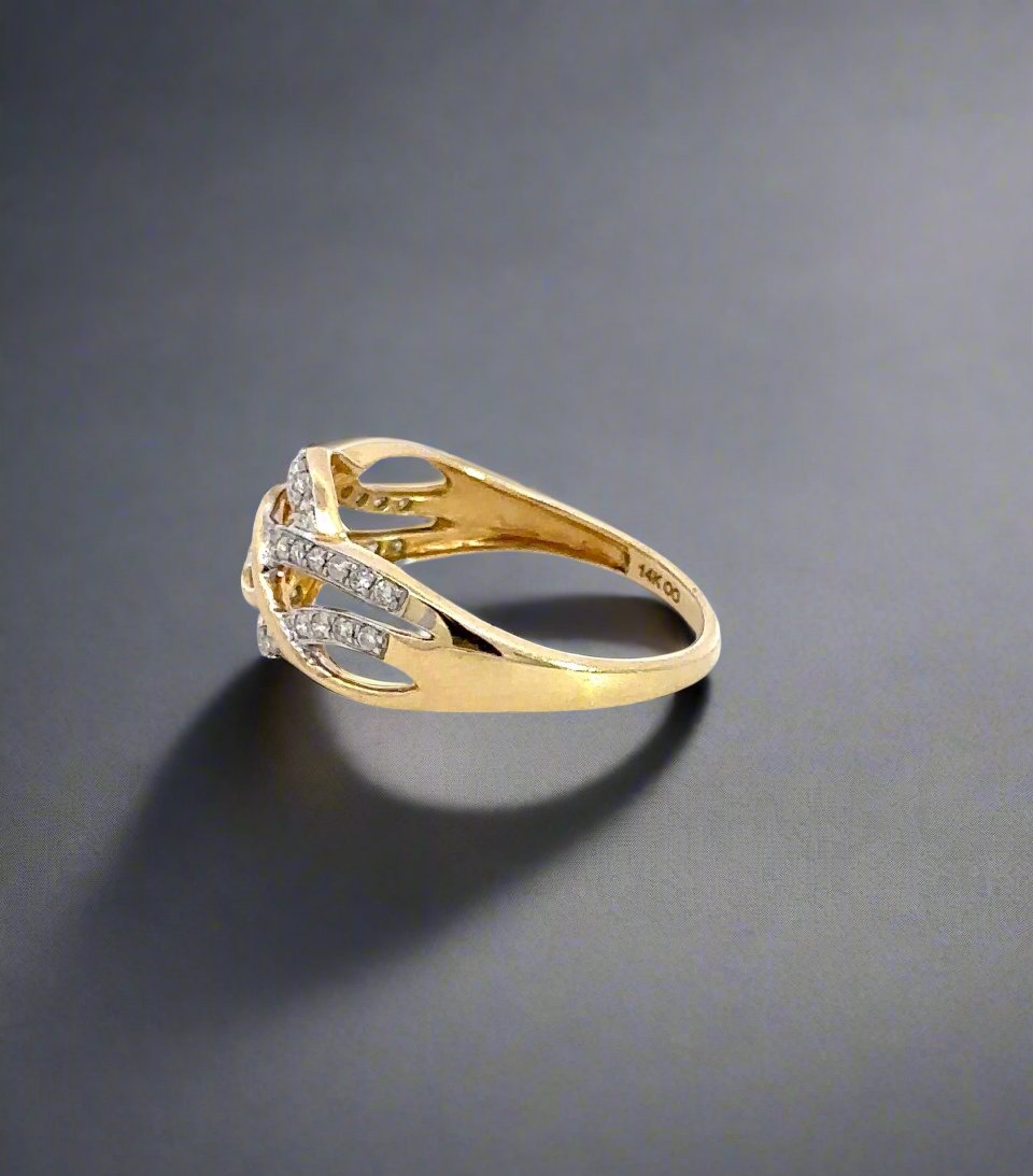 Side of yellow gold ring with 14K stamp and infinity sign engraved inside ring.