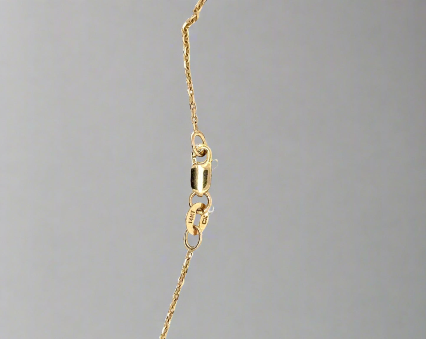 Lobster clasp of necklace. Shows scratches.
