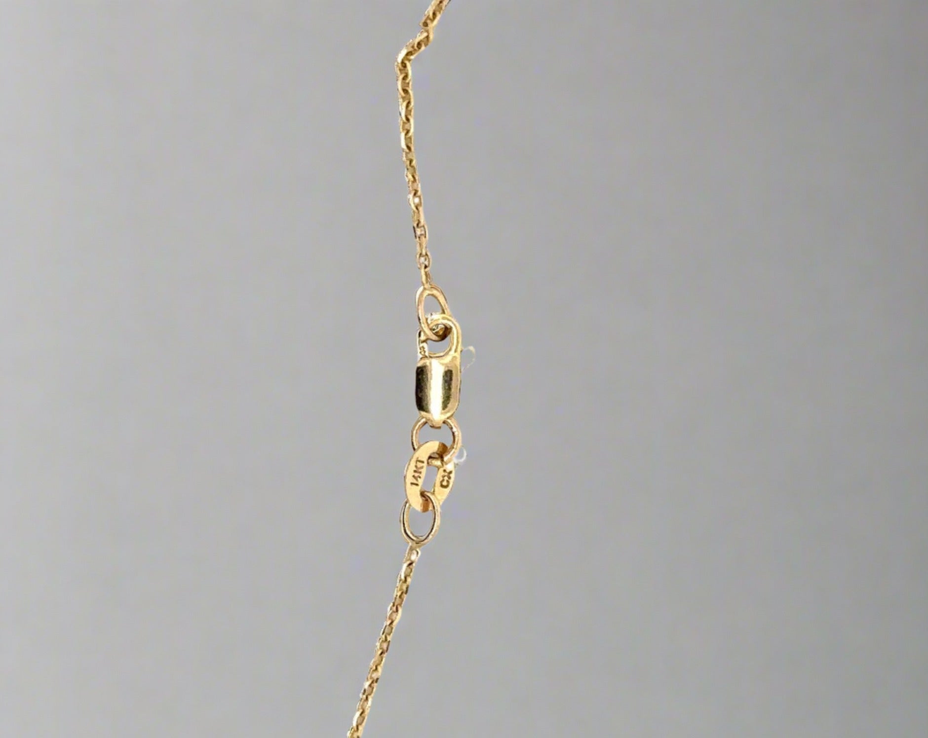 Lobster clasp of necklace. Shows scratches.