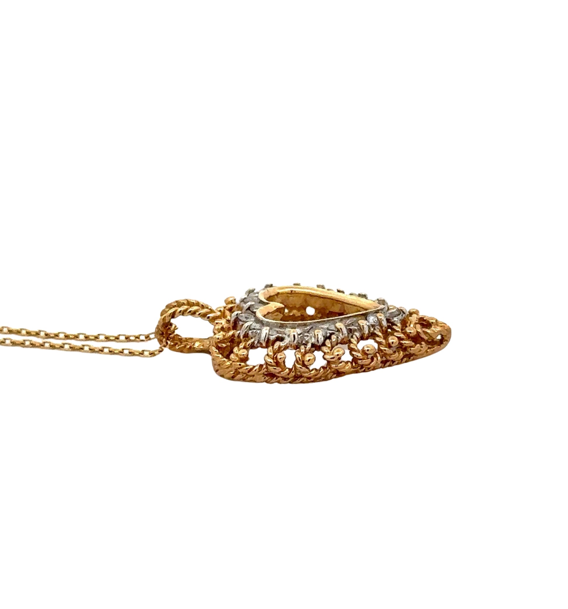 side of pendant with gold detailing