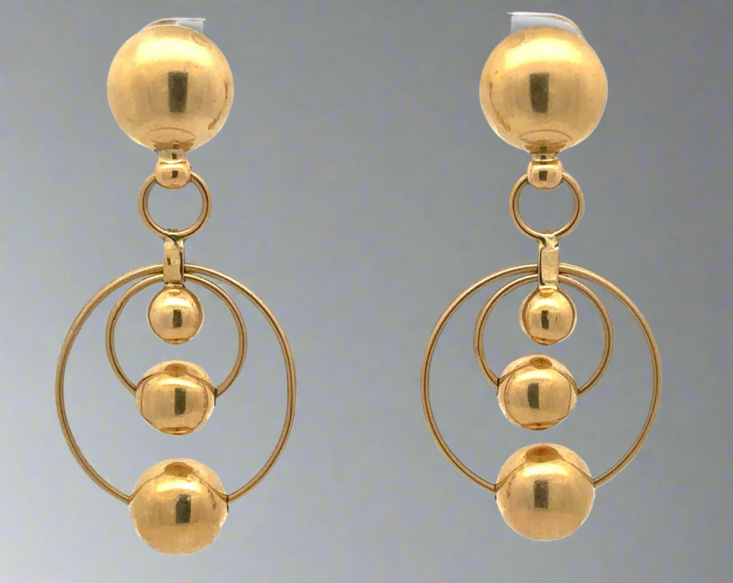 Yellow gold drop earrings with 2 hoops at the bottom and 4 gold spheres