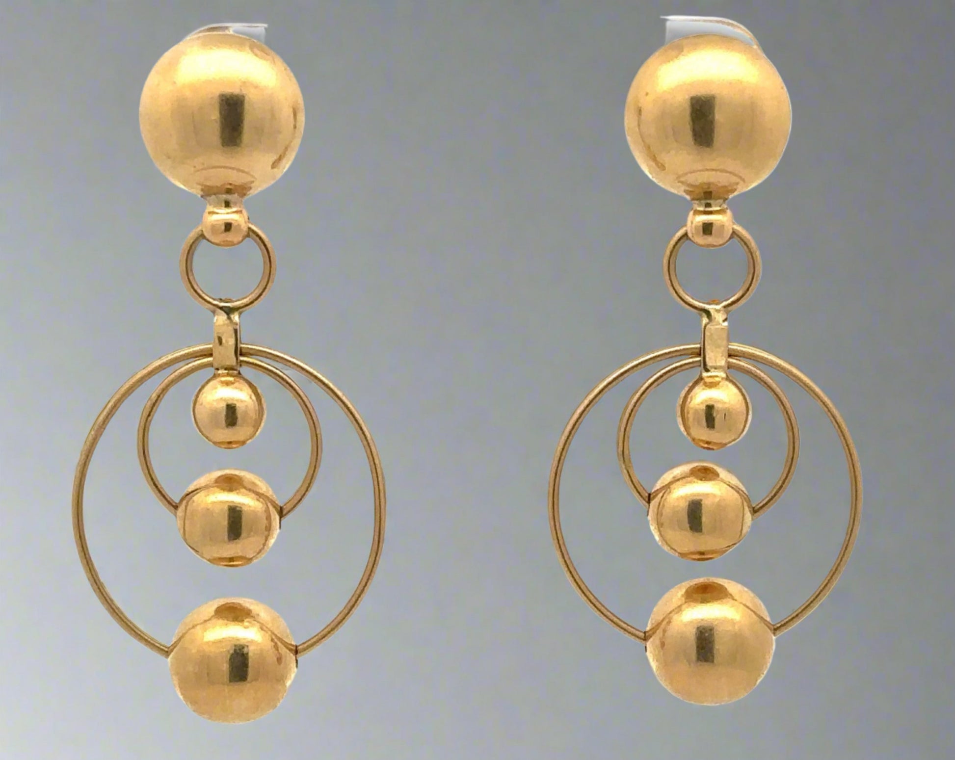 Yellow gold drop earrings with 2 hoops at the bottom and 4 gold spheres