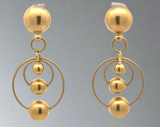 Yellow gold drop earrings with 2 hoops at the bottom and 4 gold spheres