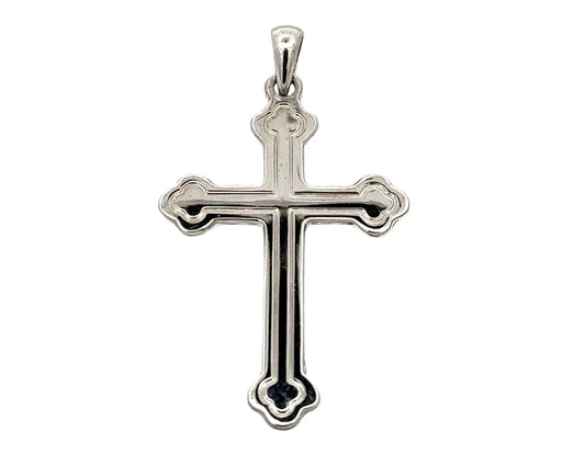 Front of white gold cross with detail lines tracing the inside. Small scratches on gold.