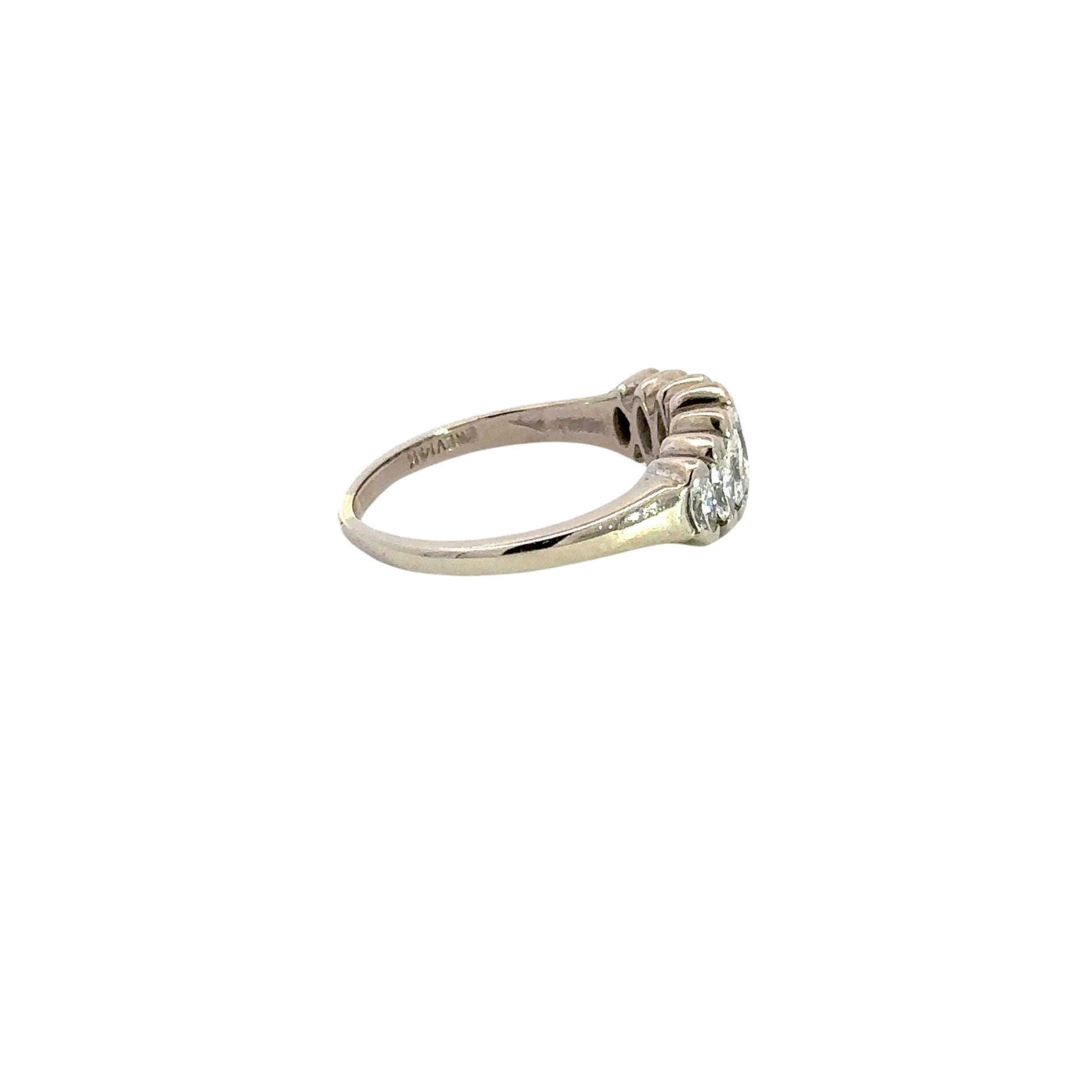 side of white gold diamond ring with scratches on gold