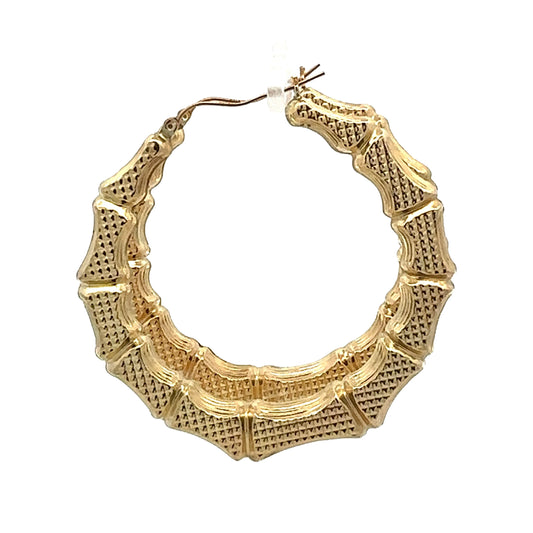 Side view of Bamboo Hoops with textured dots in yellow gold