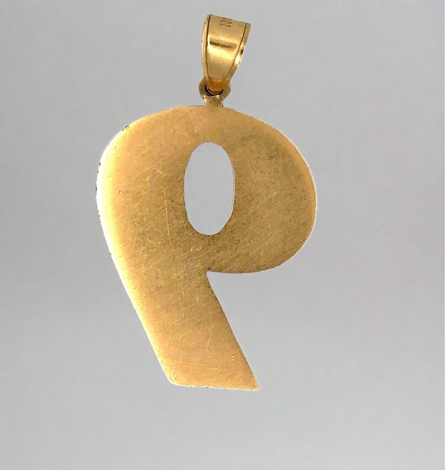 Back of 9 pendant with scratches from handling