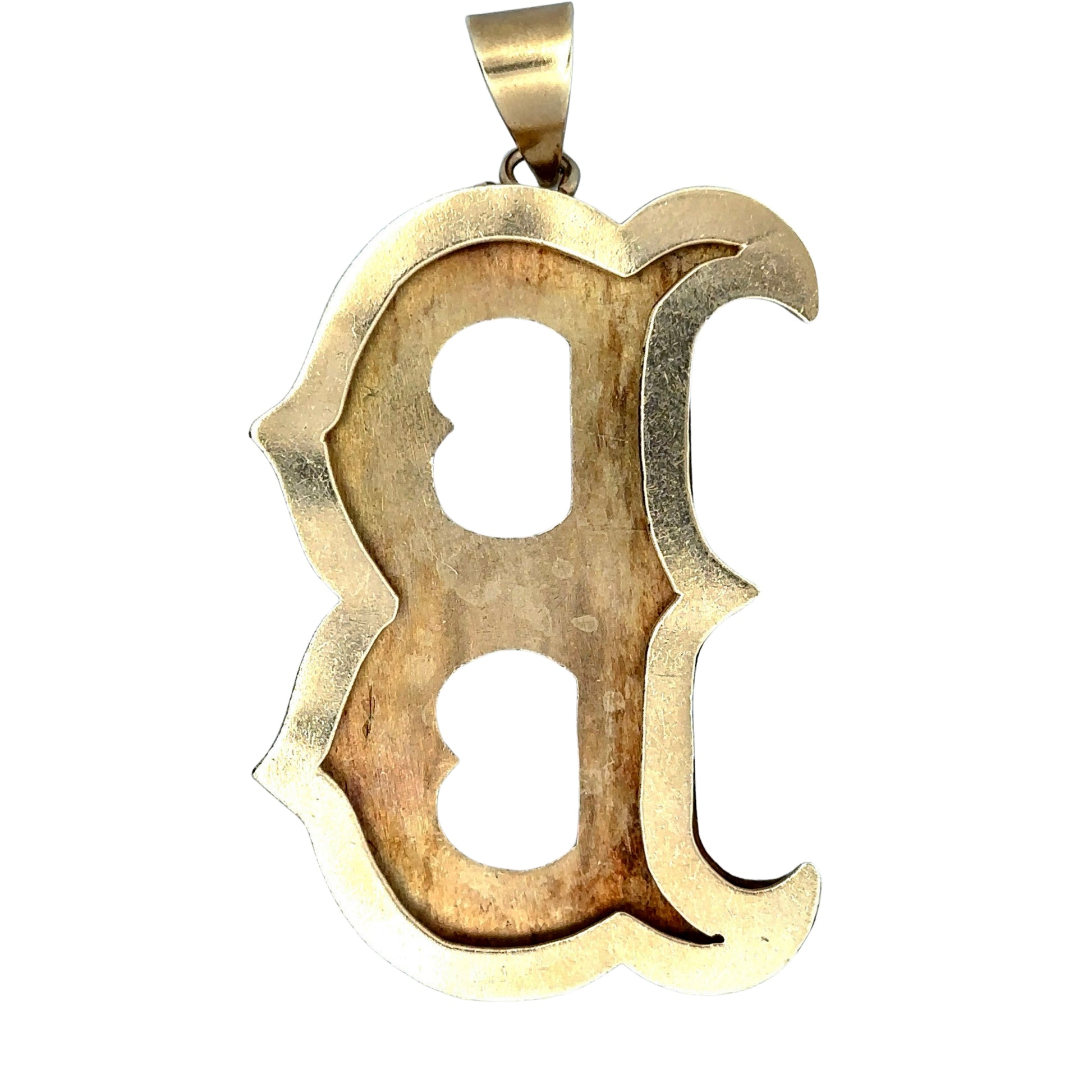 Back of yellow gold boston redsox b pendant with open back + scratches on gold