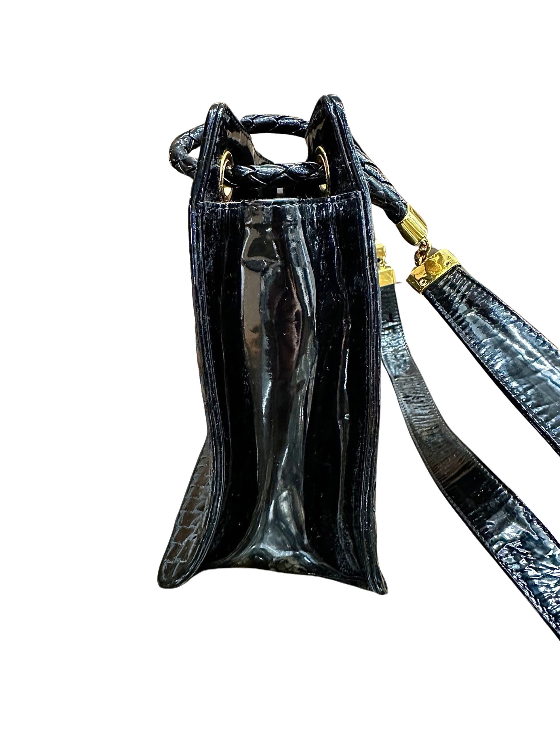 Side of black patent leather bag