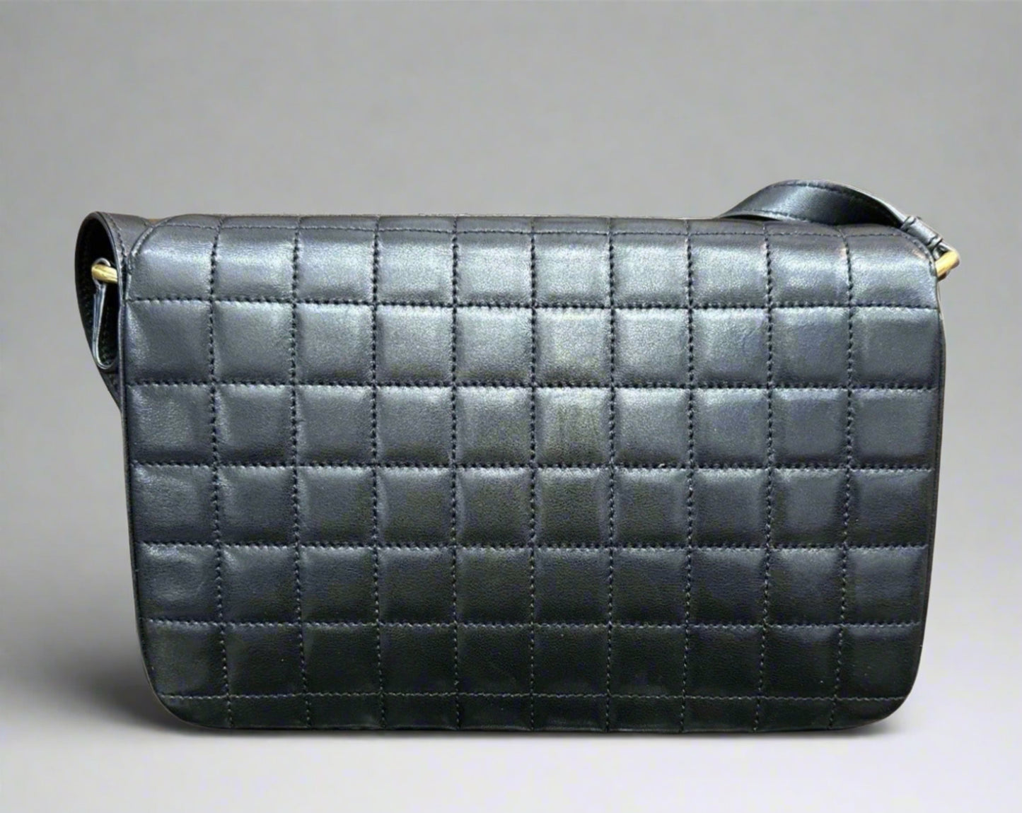 Back of black quilted bag