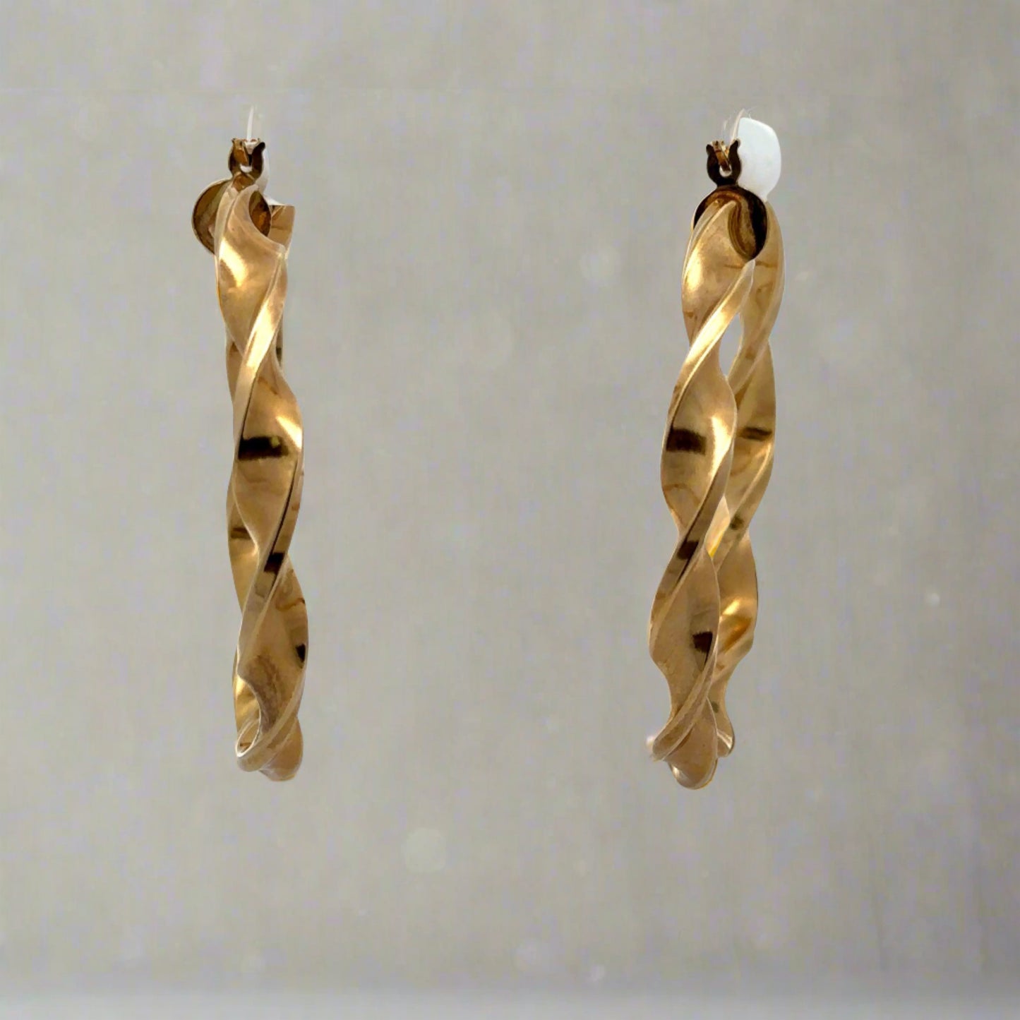 front of yellow gold twist hoops