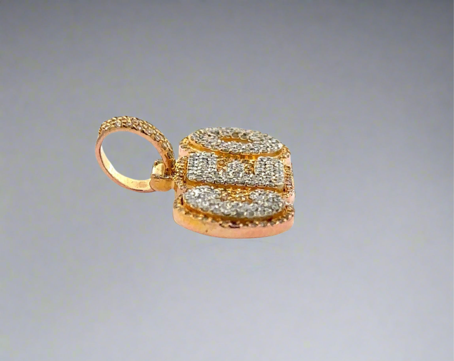 Side of CEO pendant with round bail + small scratch on side of gold