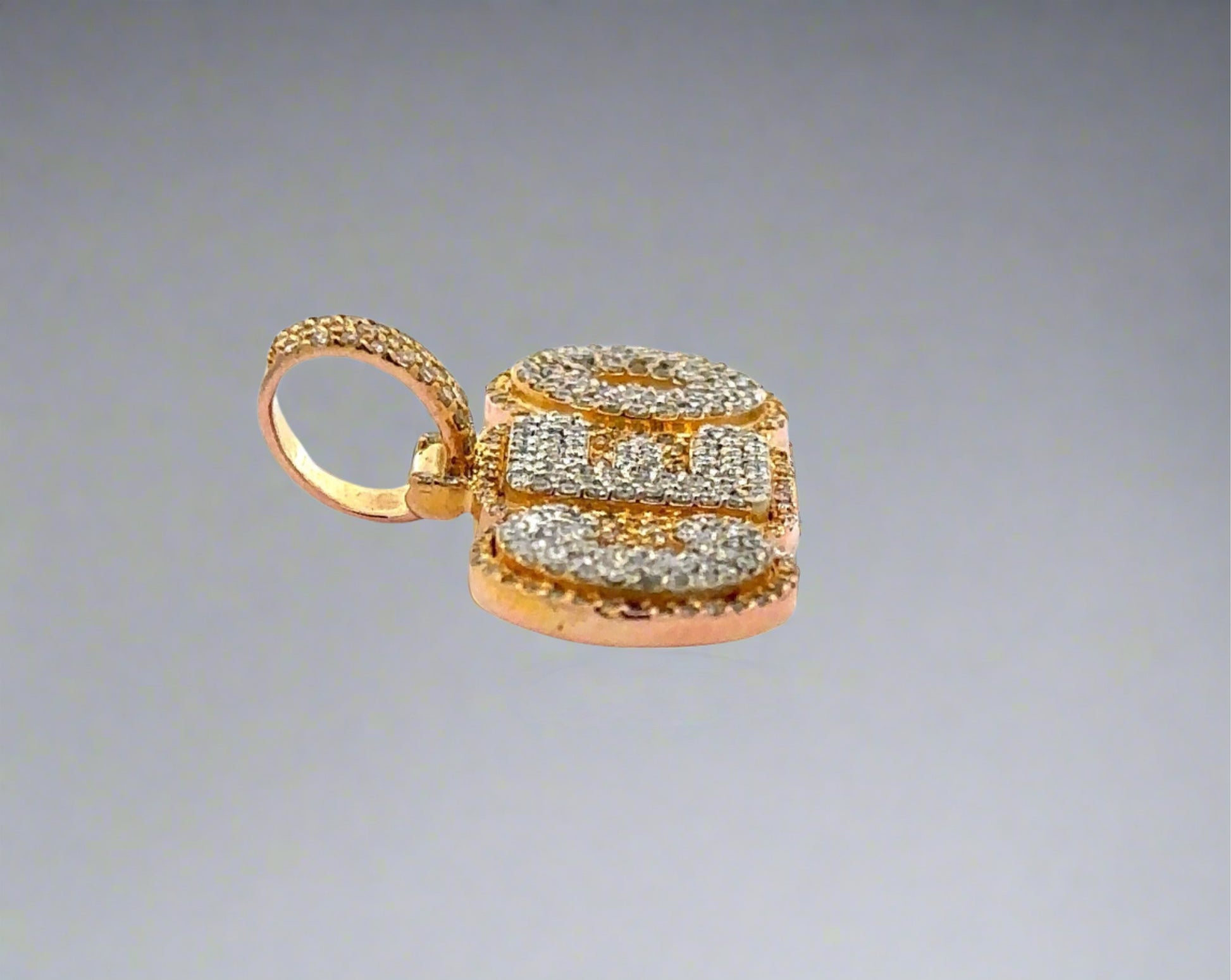 Side of CEO pendant with round bail + small scratch on side of gold