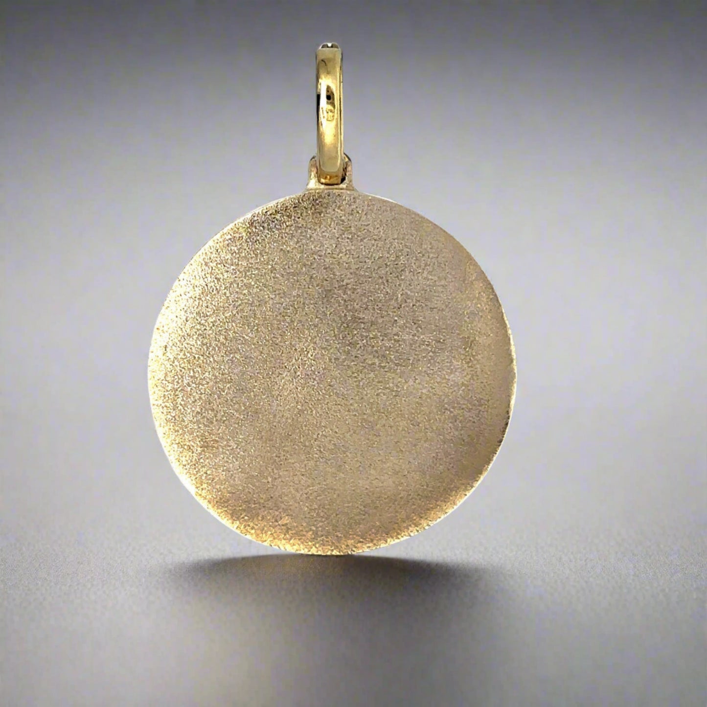Back of photo pendant with textured gold