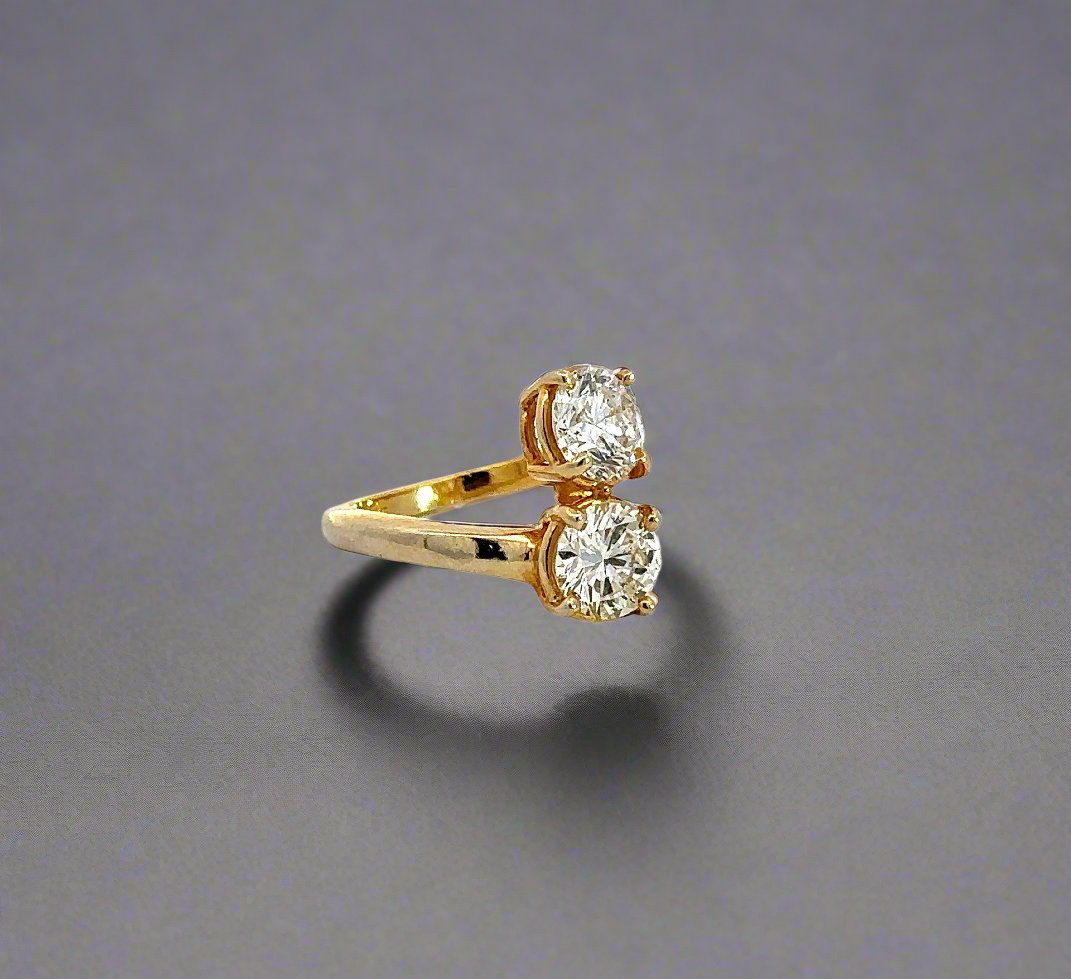 Diagonal view of 2-stone diamond engagement ring in yellow gold
