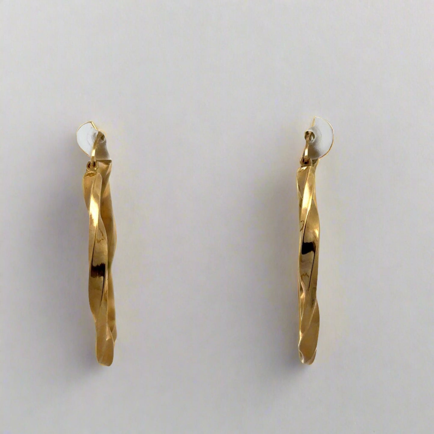 front of yellow gold twist hoops