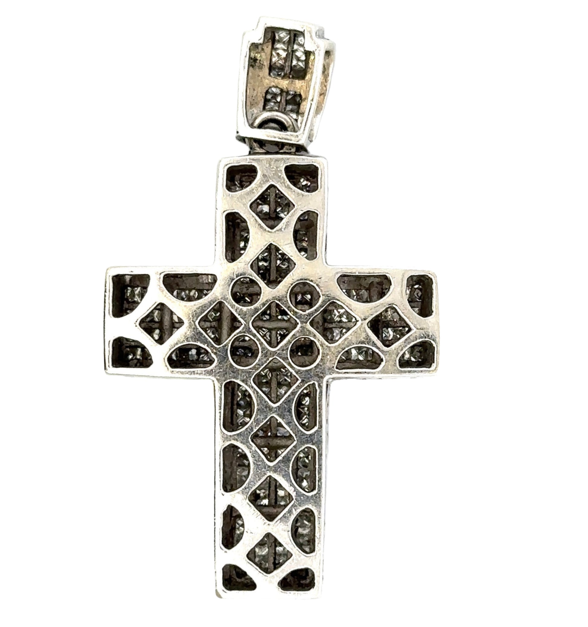 Back of white gold cross with open spaces