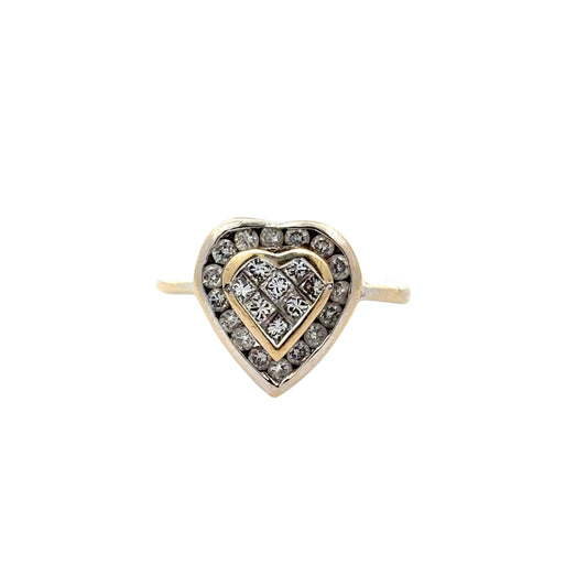white gold heart shaped ring with round diamonds on outline of heart and princess cut diamonds in center