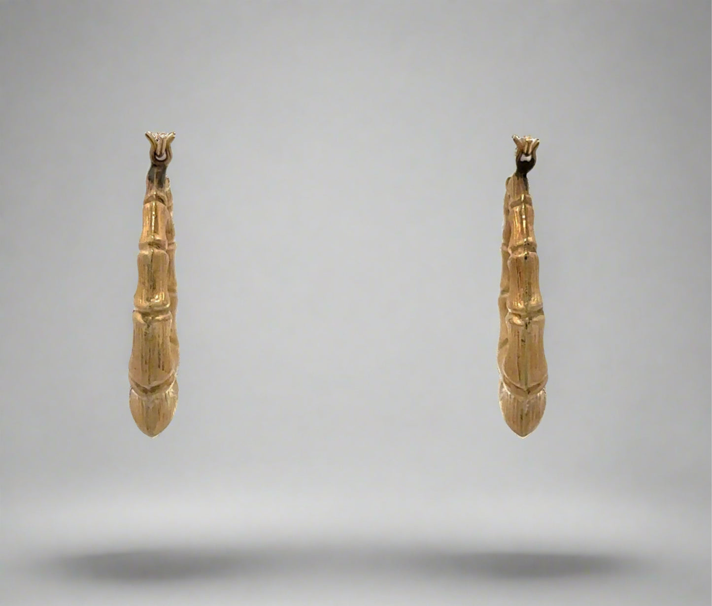 Back of yellow gold bamboo hoop earrings