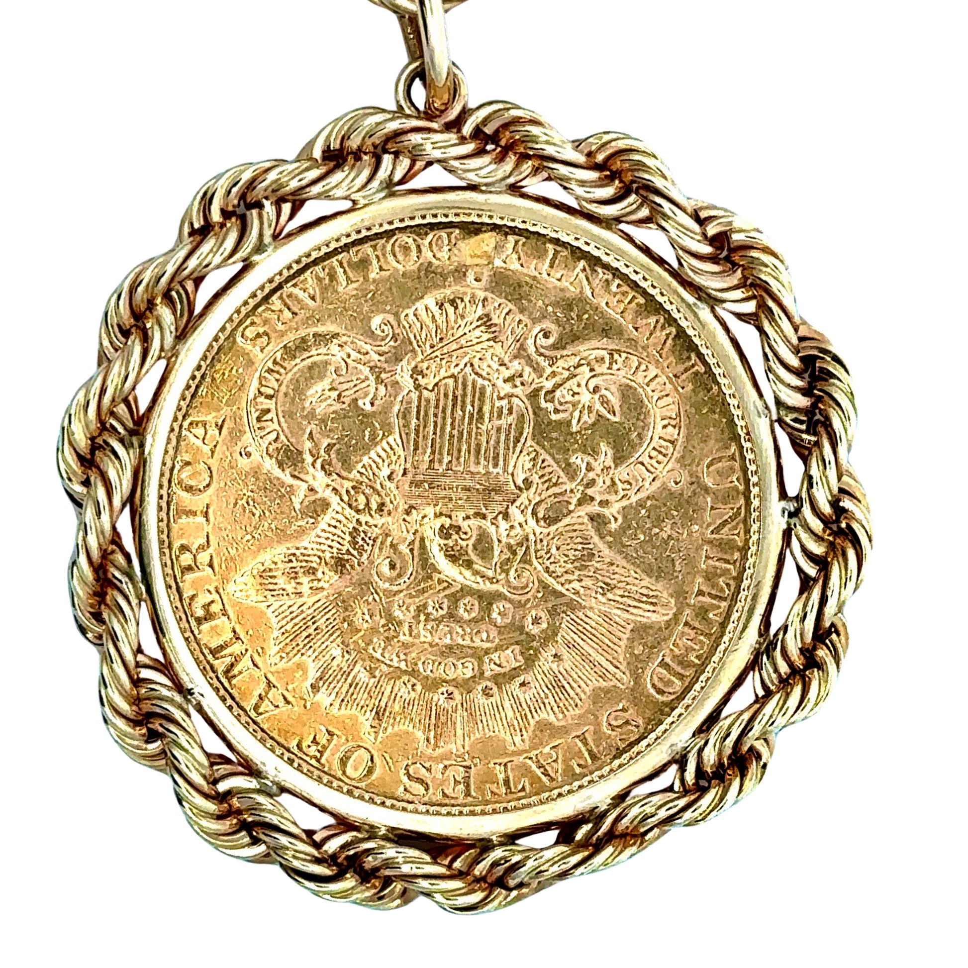 Back of yellow gold coin pendant with United States of America + Twenty Dollars on it. Scratches from handling.