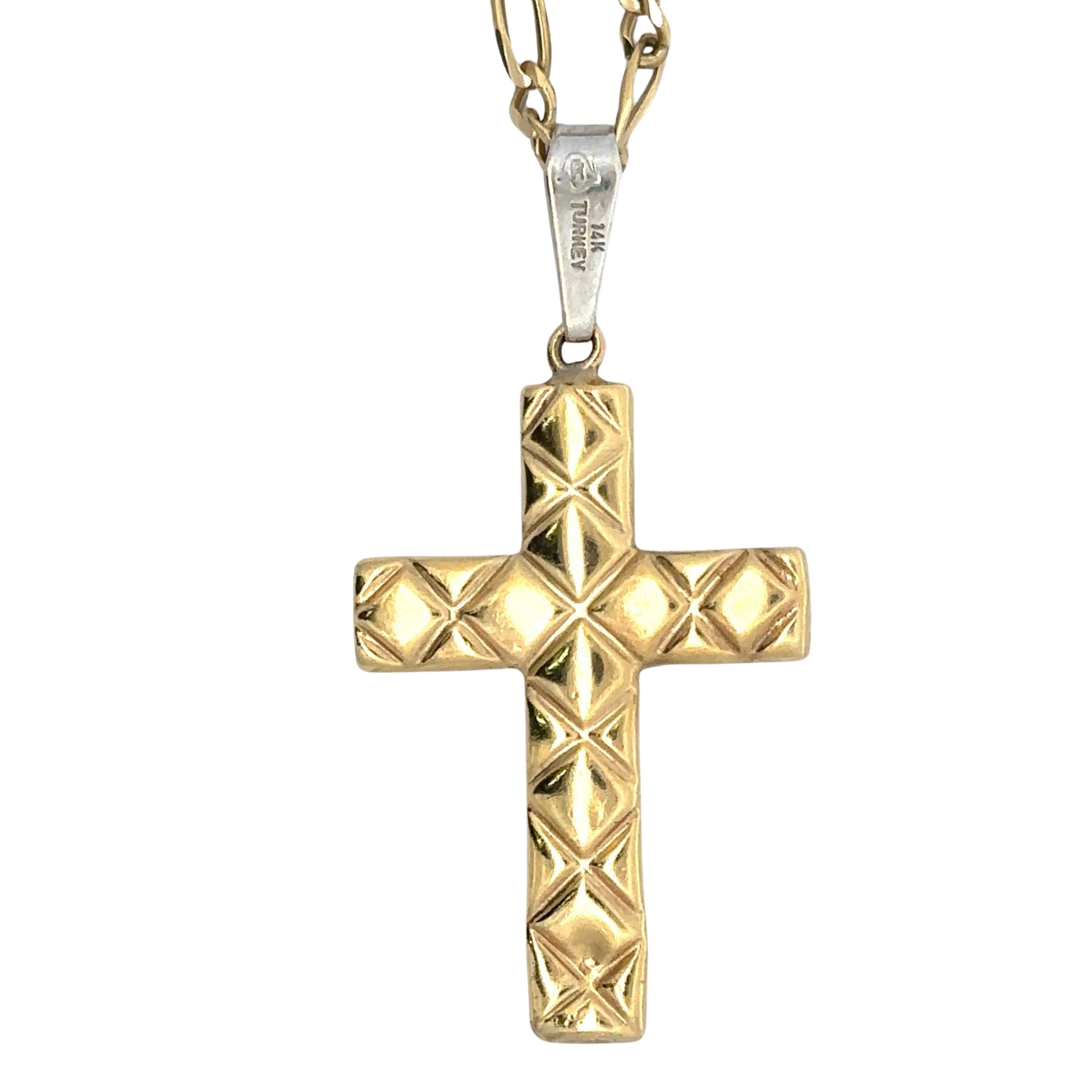 back of cross pendant with yellow gold + textured back with a 14K stamp on the white gold bail