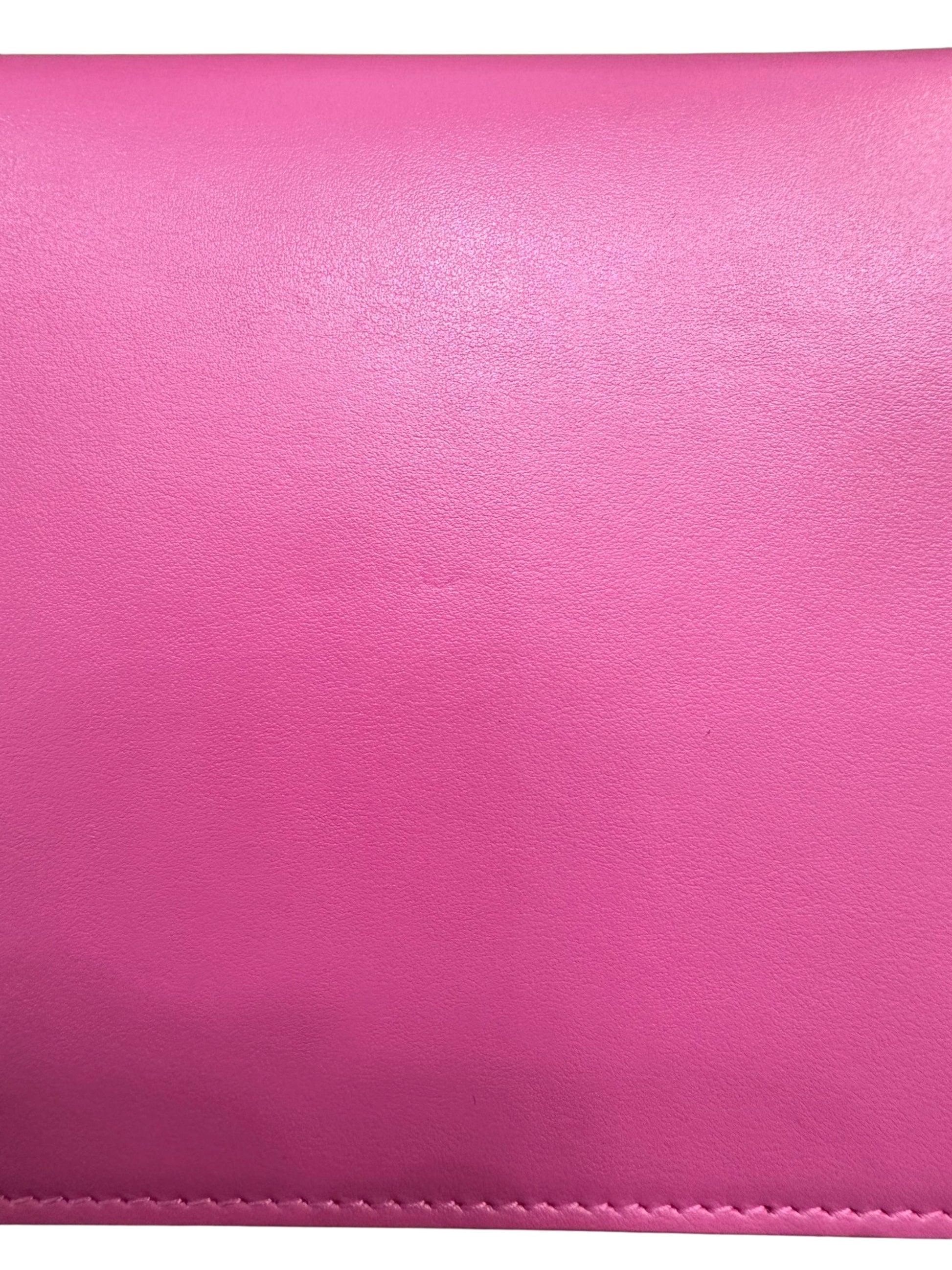 Close up of back of pink bag with light scuff mark in the middle