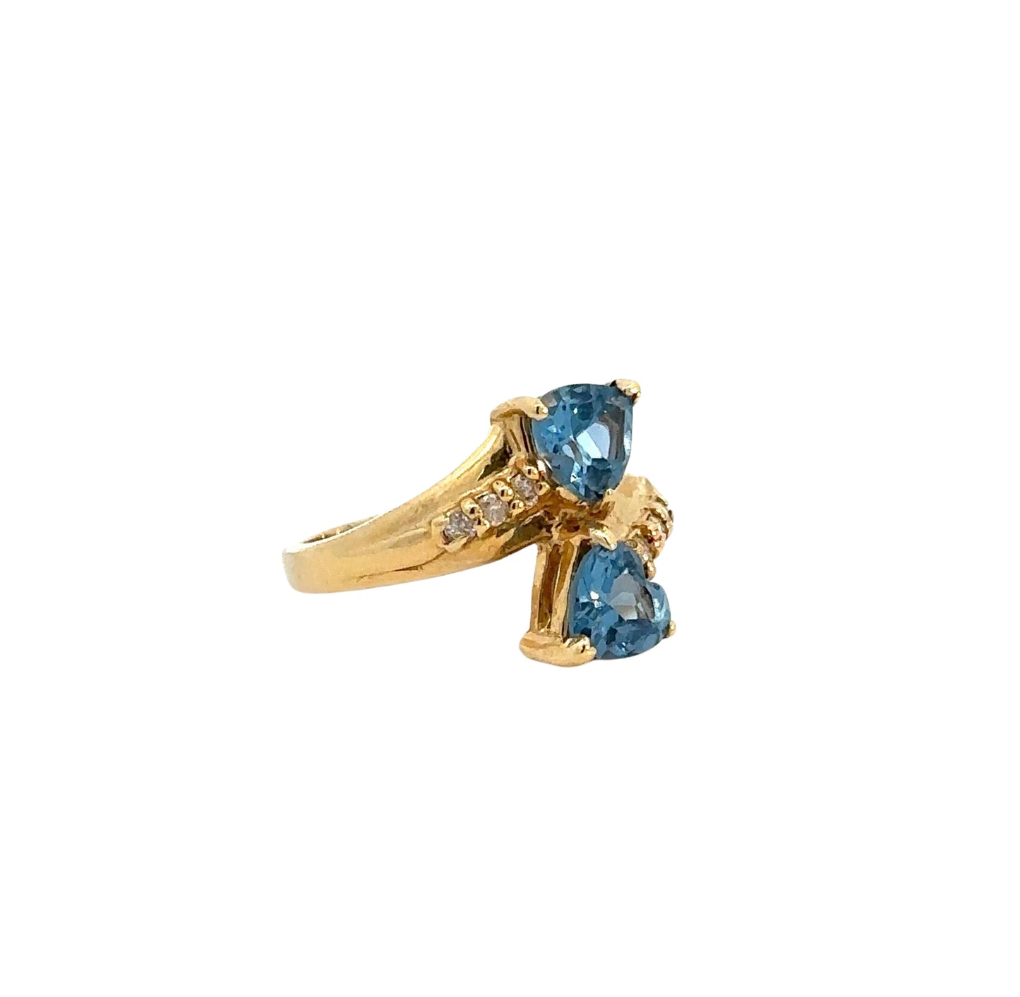 Diagonal view of blue gemstone and diamond ring