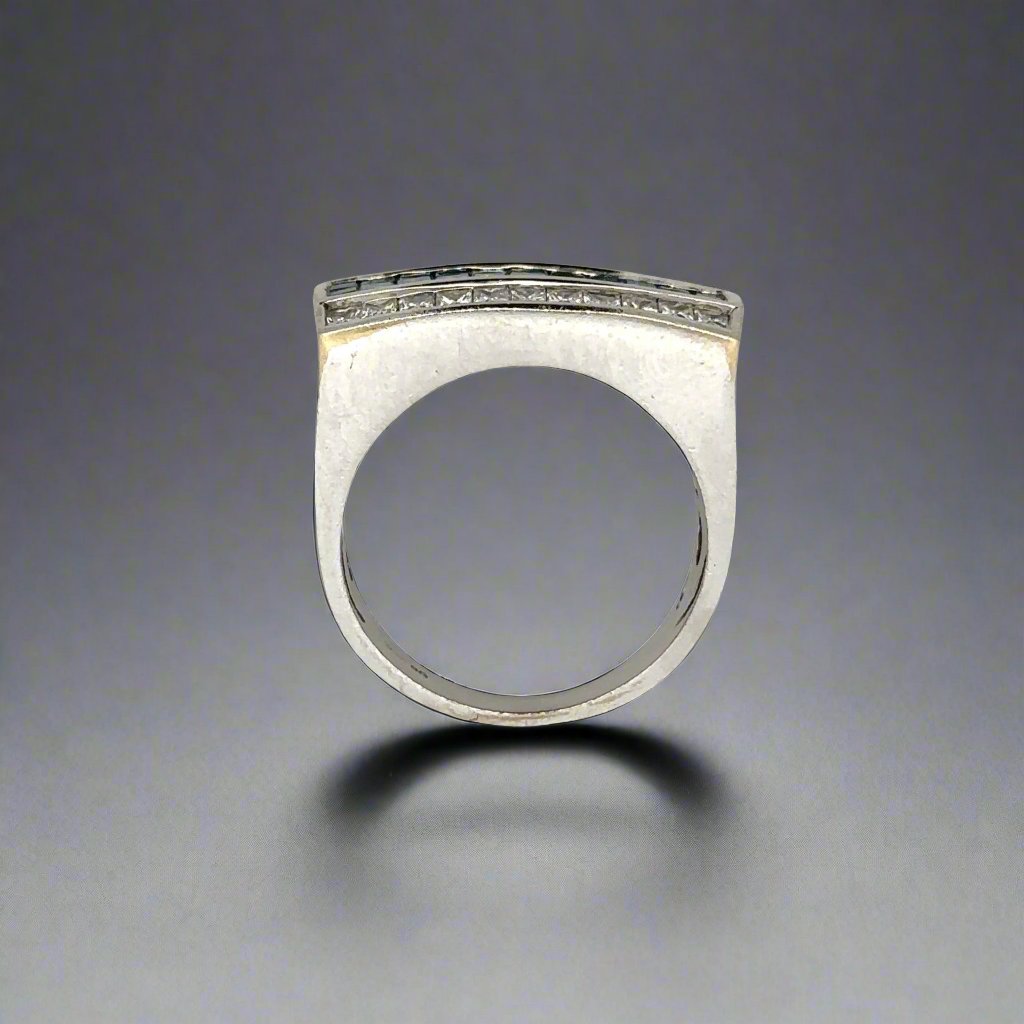 top of white gold ring with signs of wear on gold