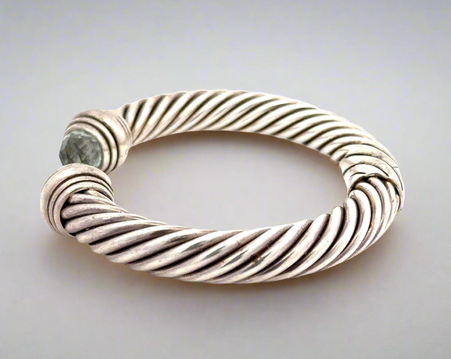 Side of silver bracele twith scratches on silver