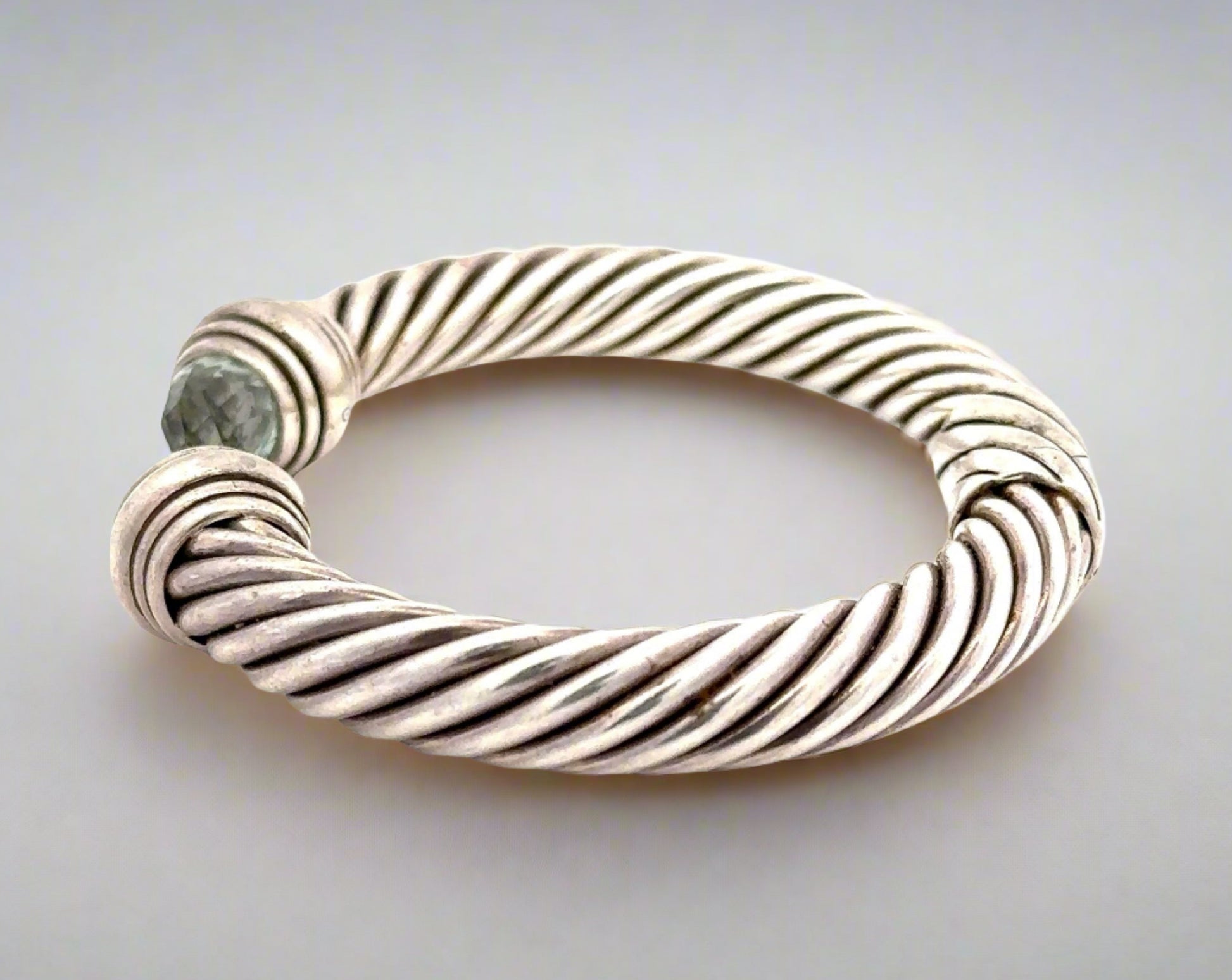 Side of silver bracele twith scratches on silver