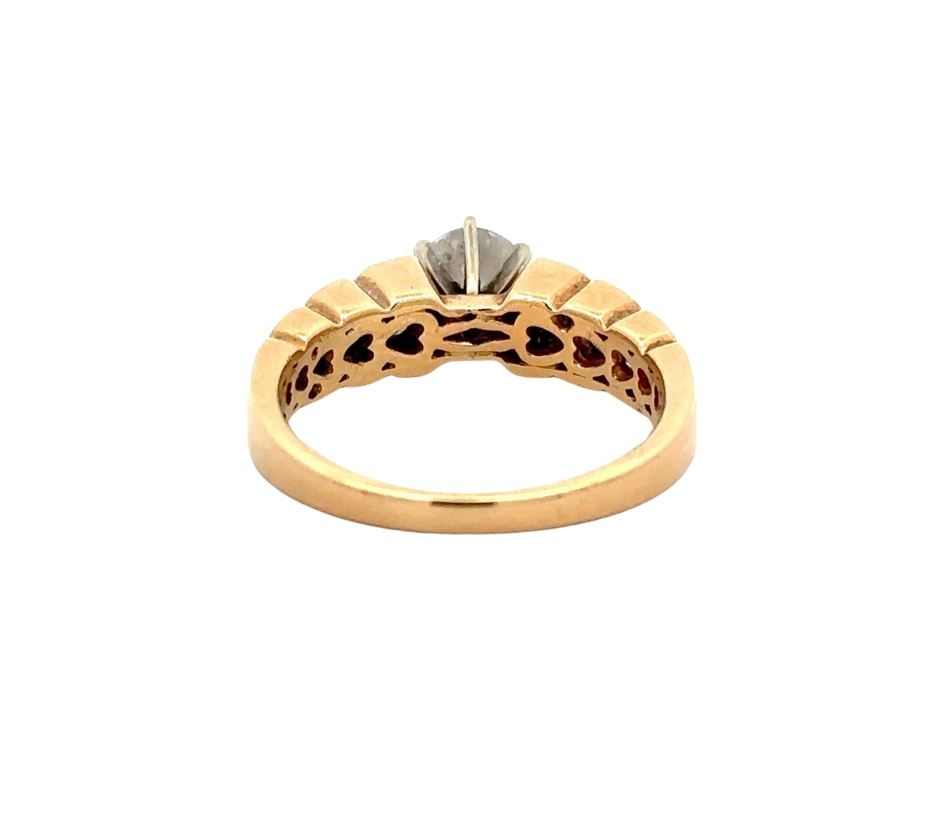 Back of yellow gold ring with heart-shaped design inside of band