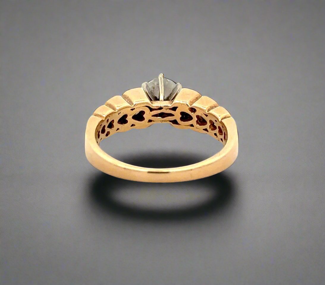 Back of yellow gold ring with heart-shaped design inside of band