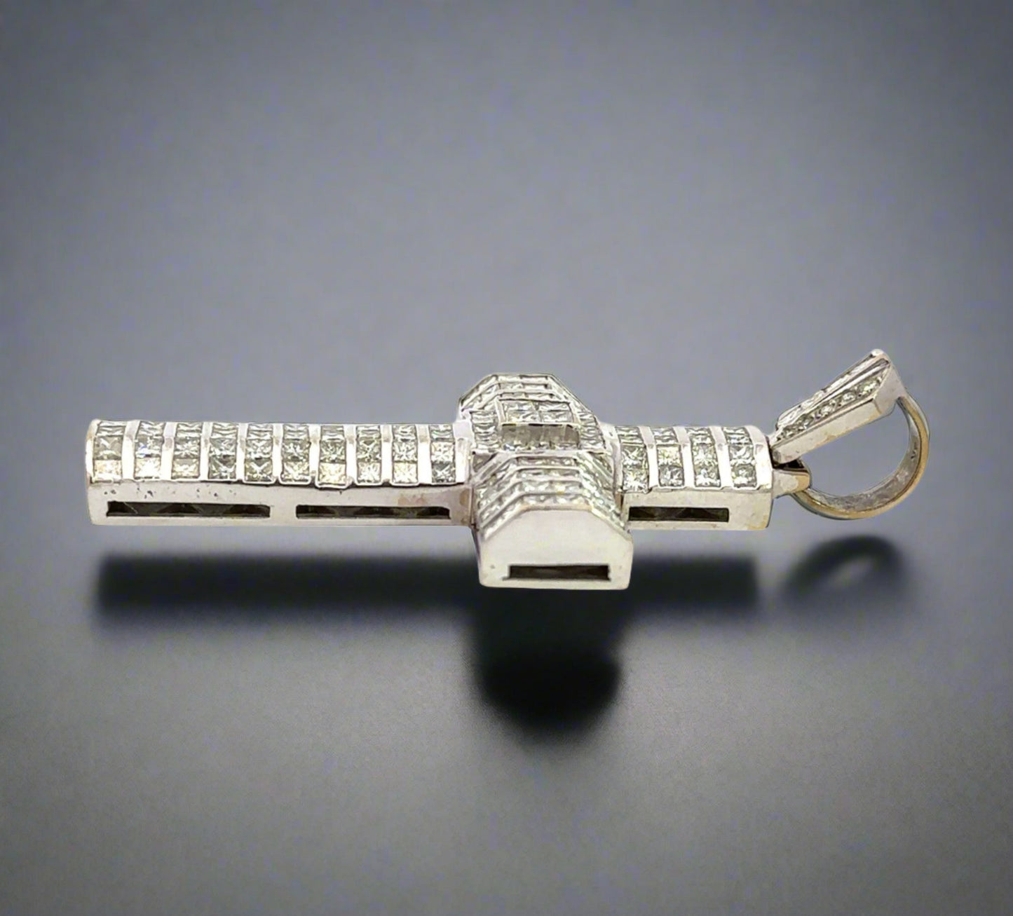 Side of white gold pendant with marks on the gold