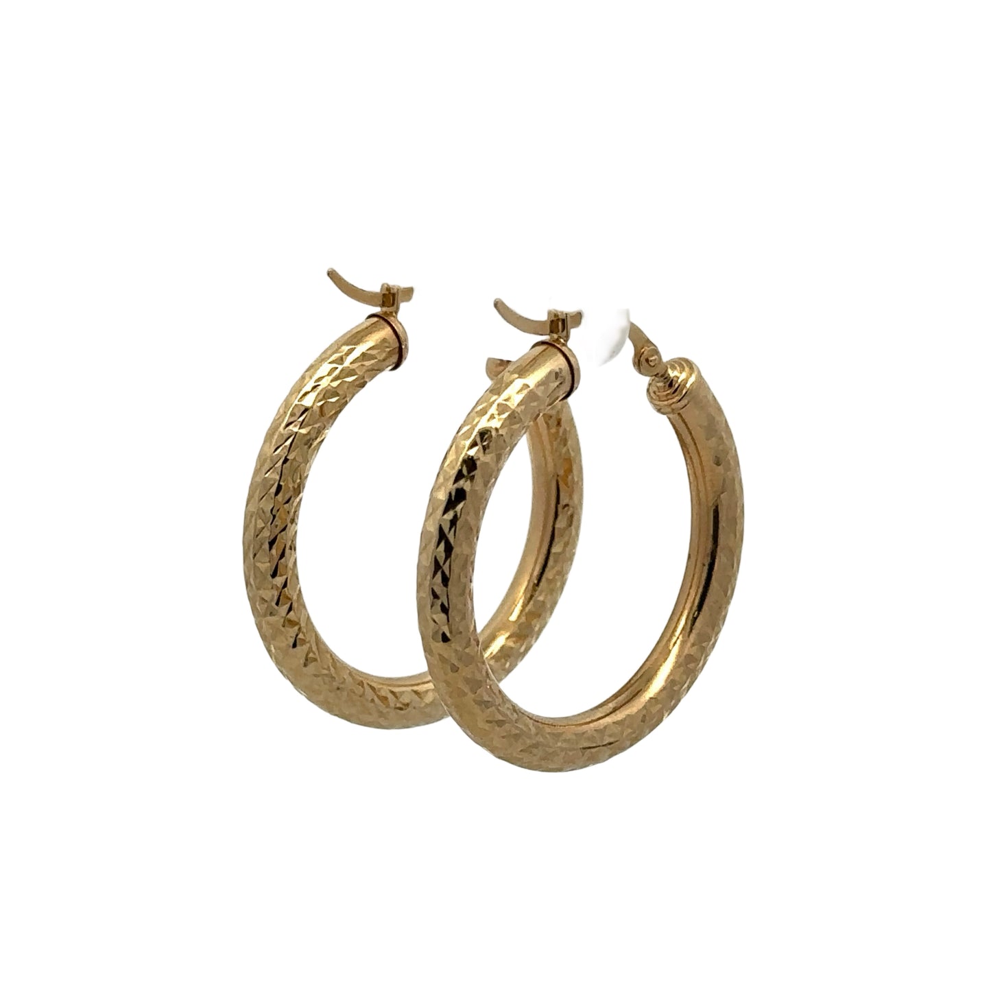 Diagonal back of yellow gold textured and polished hoops