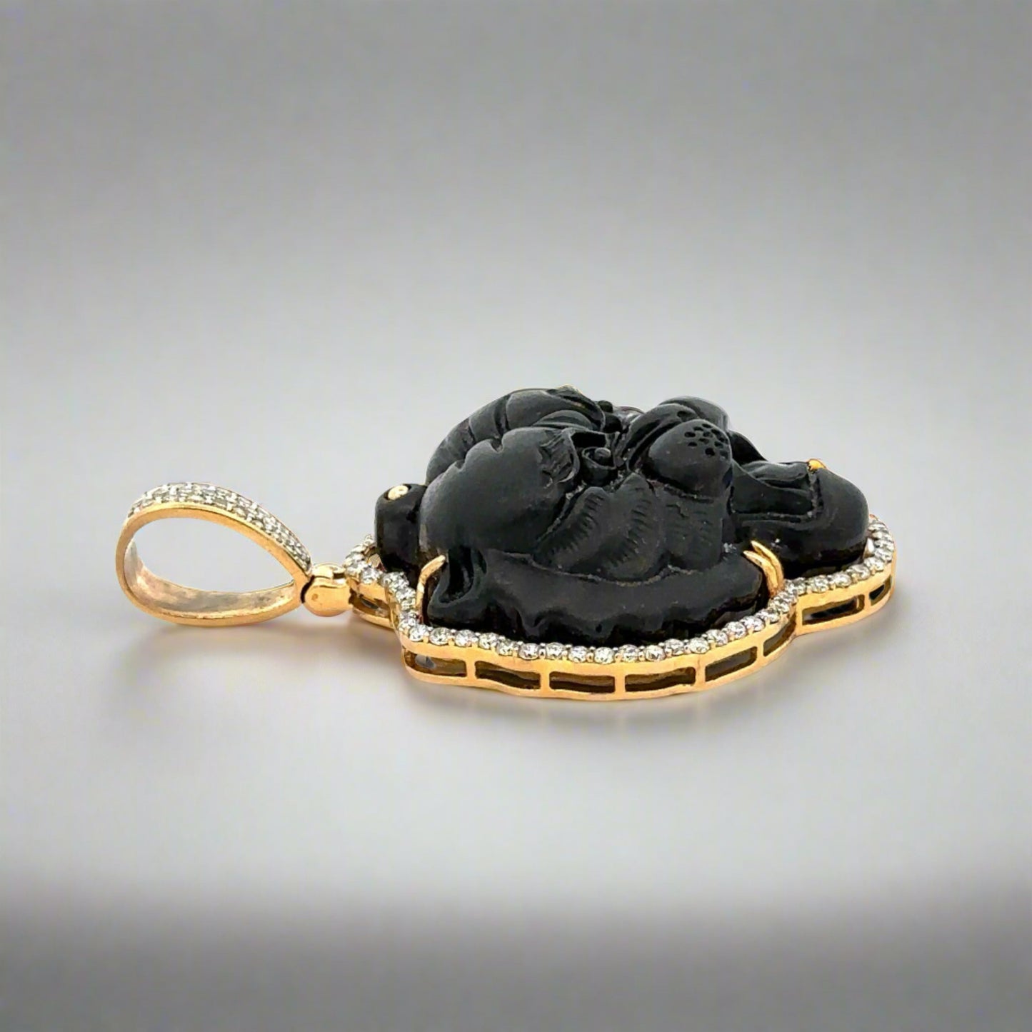 Side of diamond and obsidian tiger pendant