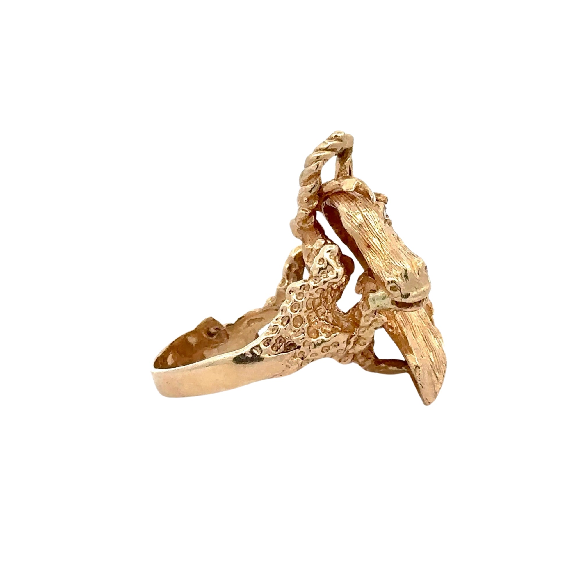 Side of yellow gold horse ring with nugget detailing on the band.