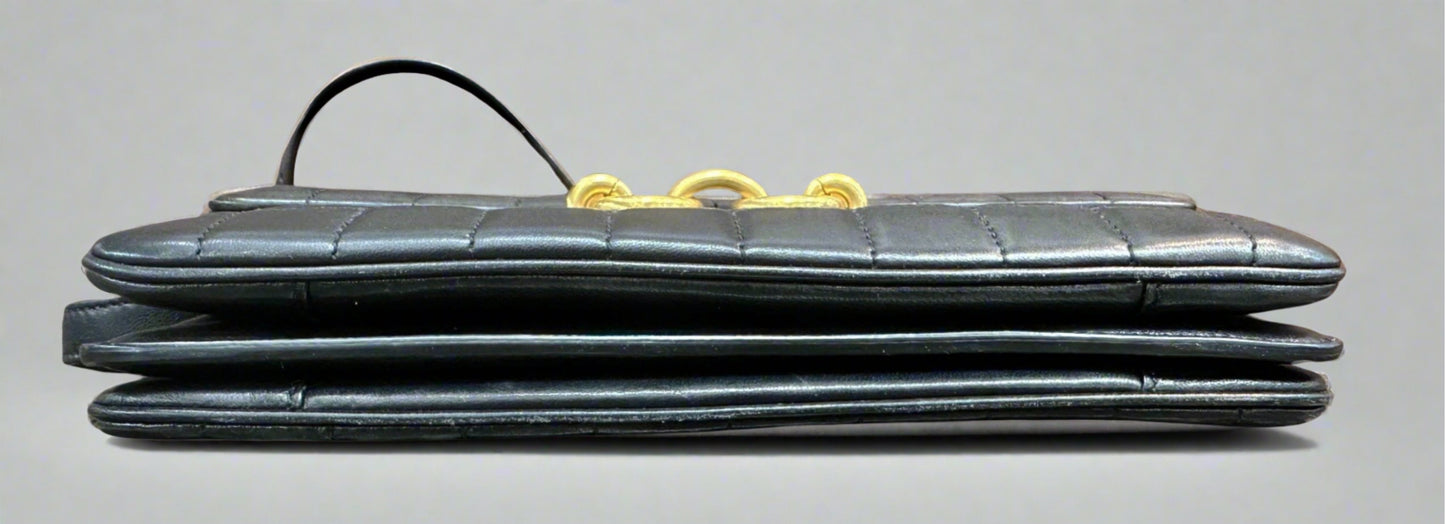 Bottom of black quilted bag