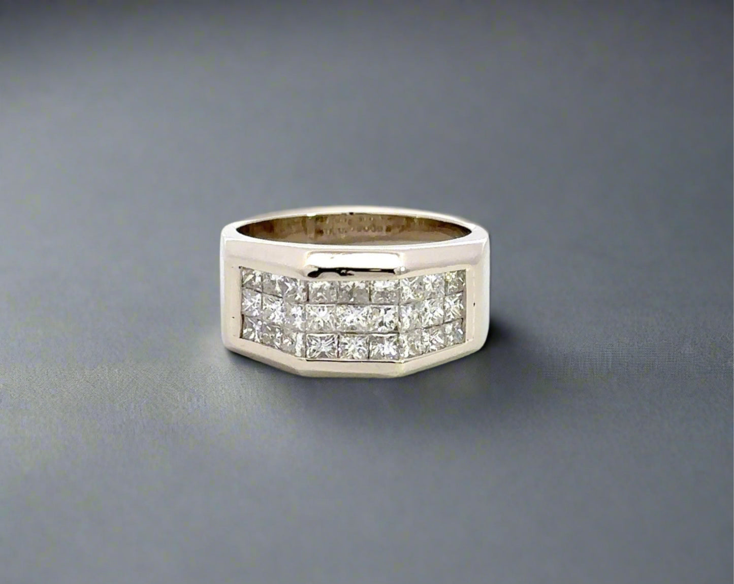 Front of white gold diamond band ring with 3 rows of princess-cut diamonds