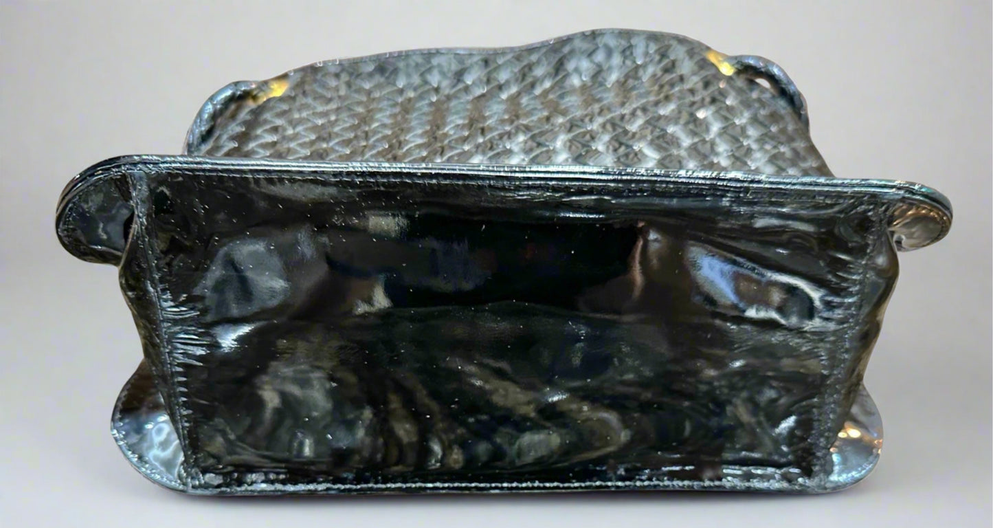 Bottom of black patent leather bag